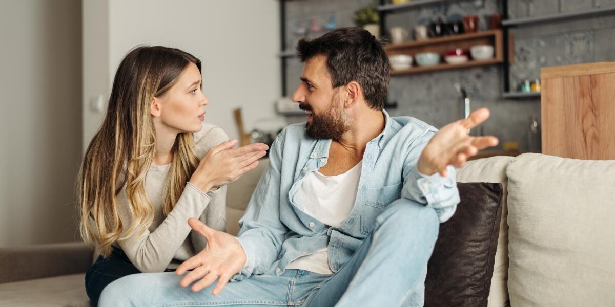 Effects of Being Married to An Alcoholic two people chatting on a couch