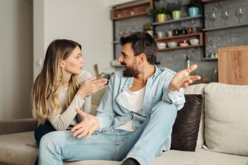 Effects of Being Married to An Alcoholic two people chatting on a couch